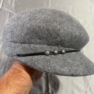 Grey wool newsboy cap with‎ black band and silver buttons